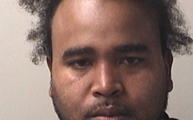 Mugshot-style portrait of a man with disheveled hair — arresto por drogas en Atmore — Atmore Drug Bust