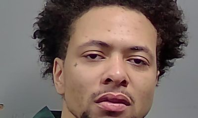 Close-up portrait of man with curly hair in green shirt — Cantonment Drug Bust