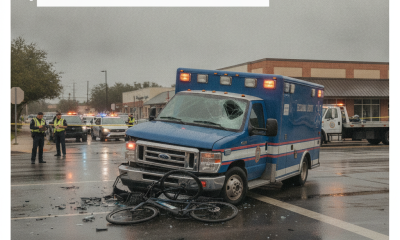 A damaged Escambia County EMS ambulance at an intersection with a crushed e-bike, emergency re — Pensacola ambulance crash