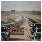 Traffic jam caused by West Roberts Road closure in Cantonment, with vehicles lined — West Roberts Road Closure Cantonment