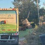 A truck from Pensacola Sanitation Services collecting storm debris after Hurricane I — Pensacola Hurricane Isaias recovery