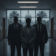 Three silhouetted men in suits stand in a government building hallway; Trent James Smith Marianna Florida is named in the…