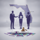 Silhouettes of three professionals discussing over an open book and gavel, with a ma — pensacola domestic violence support