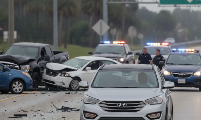 A silver Hyundai Santa Fe drives past a multi-vehicle collision on Highway 29 in — Highway 29 Hit and Run Escambia County