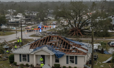 Severe damage from Hurricane Isaias in Pensacola, with a roof torn off a house and eme — Hurricane Isaias Pensacola Damage