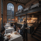 Elegant dining scene at The District Seville Steak and Seafood with patrons enjoying meals in a stylish interior.