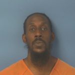 Front-facing mugshot of man in orange jail uniform — Ian Jared Keatts Cantonment