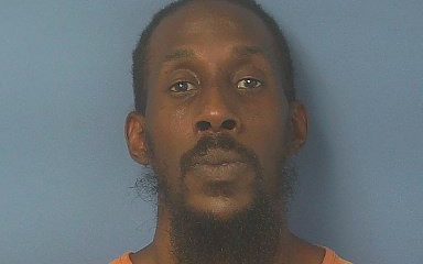 Front-facing mugshot of man in orange jail uniform — Ian Jared Keatts Cantonment