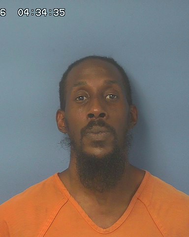 Front-facing mugshot of man in orange jail uniform — Ian Jared Keatts Cantonment
