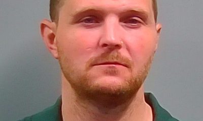 Man in green collared shirt against gray background — West Nine Mile Road Bank Robbery — robo a banco en Pensacola
