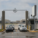 Vehicles entering NAS Pensacola through the West Gate, with a military personnel checkin — NAS Pensacola Normal Operations