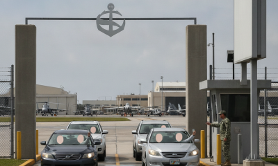 Vehicles entering NAS Pensacola through the West Gate, with a military personnel checkin — NAS Pensacola Normal Operations