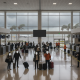 Passengers waiting in a nearly empty airport terminal as stormy weather approaches, h — Pensacola airport Hurricane Isaias